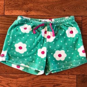 Mini Boden towelling girls shorts. Sea green with white/pink flowers. Size 7 yr